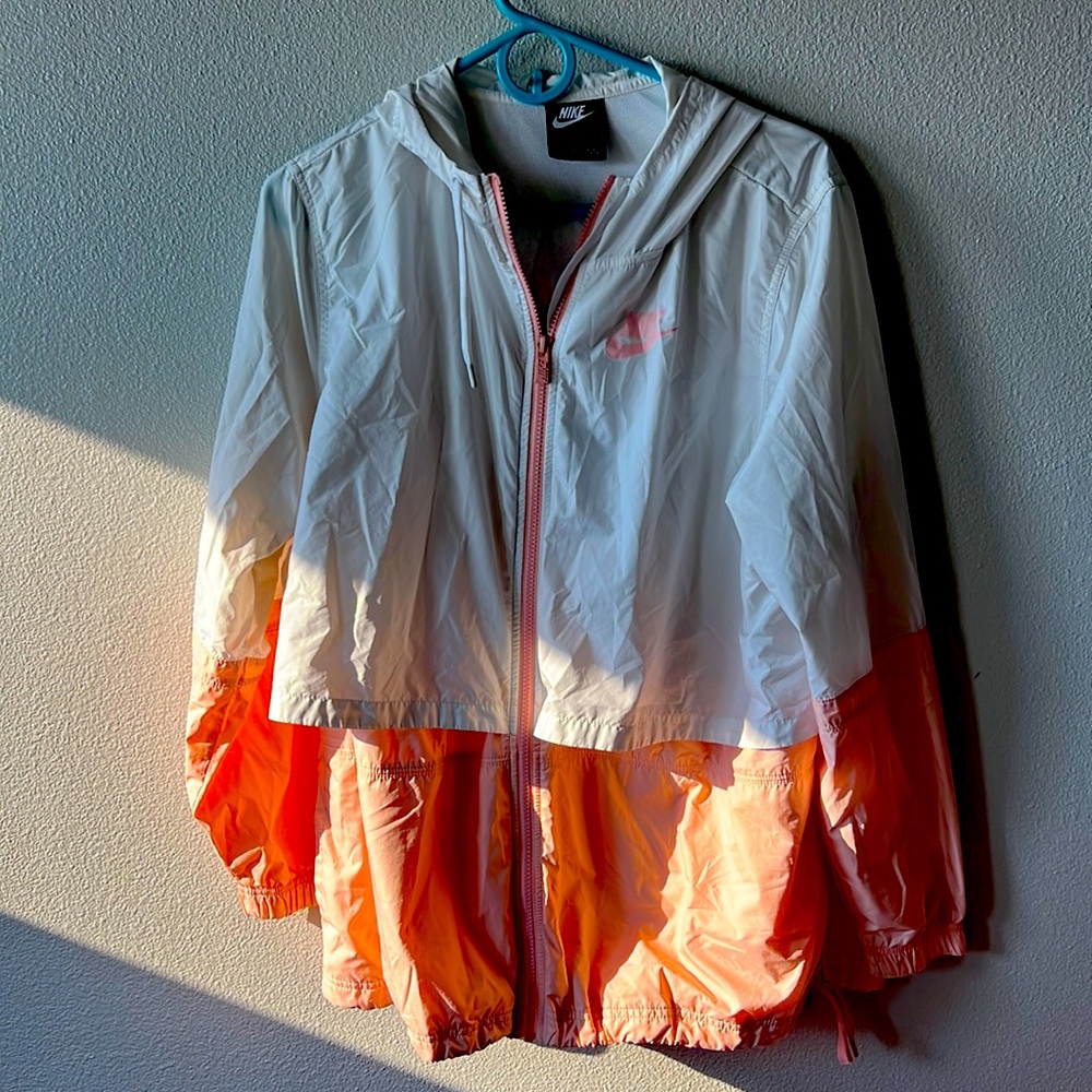 Pink and white Nike windbreaker